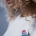woman with a vote pin